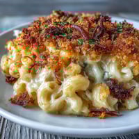 Creamy Mac and Cheese Bake with golden panko topping and bubbling cheddar sauce, baked to perfection for a comforting family dinner.